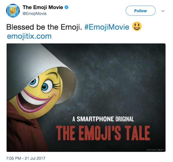 Tweet from @EmojiMovie: "Blessed be the Emoji. #EmojiMovie emojitix.com" with image of smiling emoji superimposed over poster for The Handmaid's Tale, retitled "The Emoji's Tale."