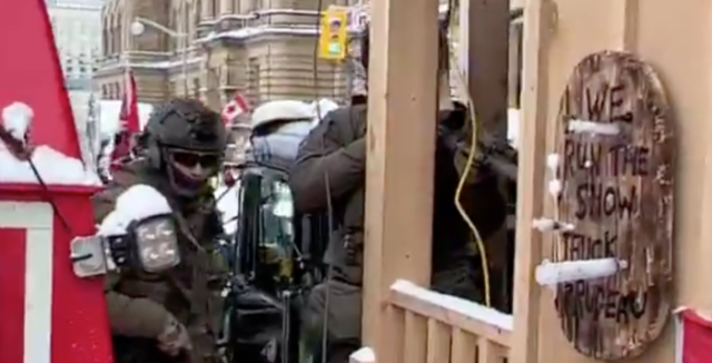 Officers enter Paisley's "shed"